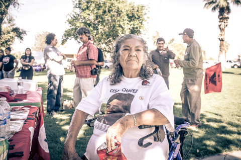 On Sunday, March 29, Maria Serrano, a veteran organizer for the United Farm Workers, sits next to a table displaying UFW memorabilia from 1979. Serrano and other former UFW organizers gathered at the Vietnam Veterans Park in Coachella for "El Precio de la Justicia," a an event to celebrate the life and legacy of Cesar Chavez.  Photo: CHRISTIAN MENDEZ / Coachella Unincorporated